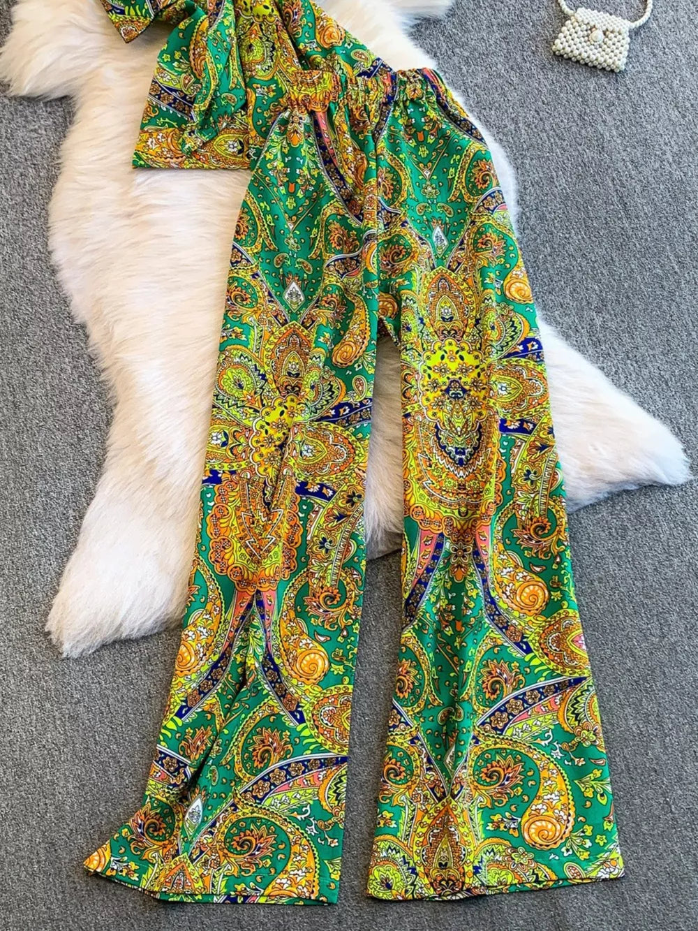 Green paisley print cami and wide-leg pant set with colorful patterns.