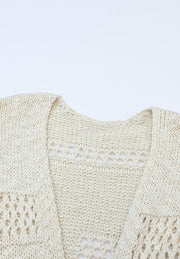 Beige open-knit slouch cardigan with crochet detail and relaxed fit.