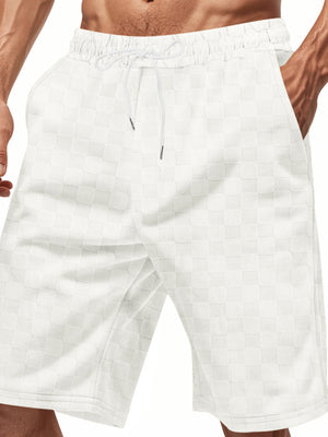 White checkered chino shorts for men with drawstring waist and pockets.