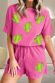 Cerise waffle knit lounge set with cactus appliques, short sleeve top and drawstring shorts.