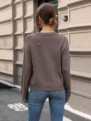 Distressed knit crewneck sweater in coffee brown with ripped details.