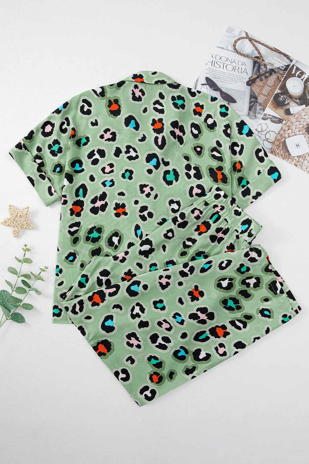 Sage leopard print resort shirt and trousers set with collared neckline and short sleeves.
