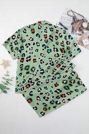Sage leopard print resort shirt and trousers set with collared neckline and short sleeves.