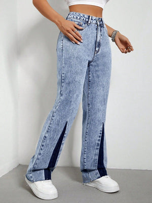 Light acid wash bootcut jeans with split hems and dark denim insets.