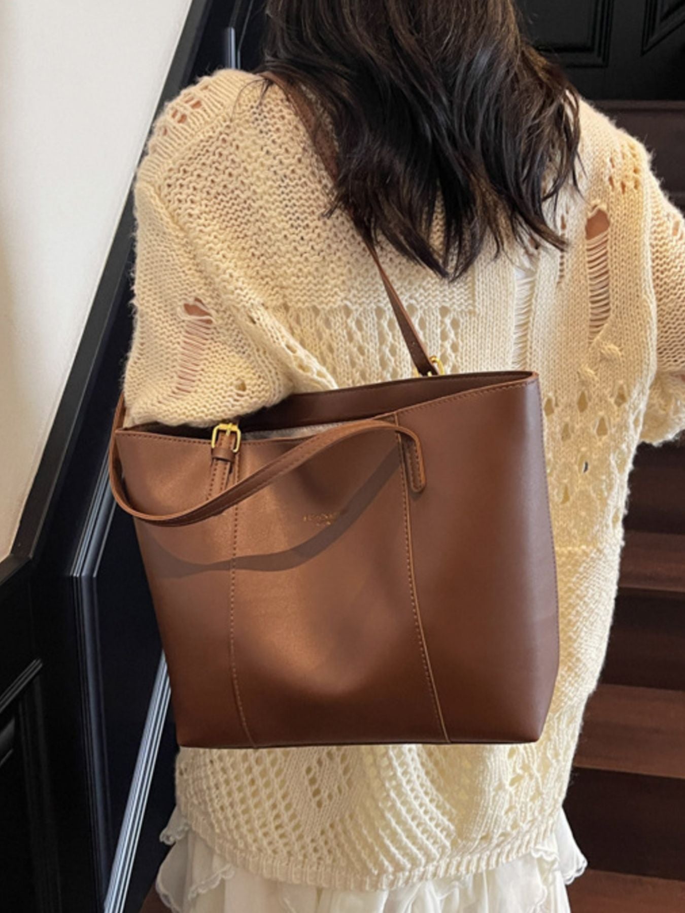 Brown structured pu leather tote bag with gold buckle detail and shoulder strap.