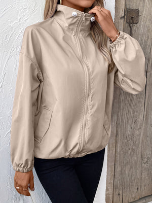 Nylon bomber jacket in mocha with drawstring hem and elastic cuffs.