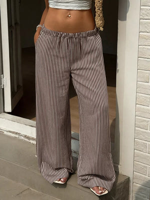 Tied striped wide-leg pants in brown and cream, featuring a comfortable elastic waist.