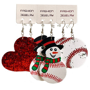 Festive sports trio earrings set with glitter heart, snowman, and baseball designs.