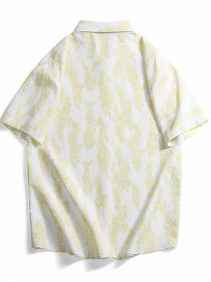 Cotton button-up shirt in white with abstract neon yellow pattern.