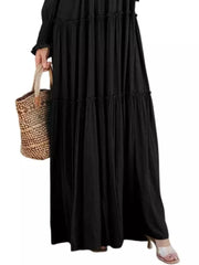 Black smocked v-neck tiered maxi dress with long sleeves and a ruffled hem.