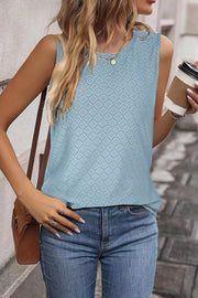 Light blue textured sleeveless shell top with a diamond pattern.
