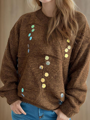 Brown knit sweater with scattered round sequin embellishments.