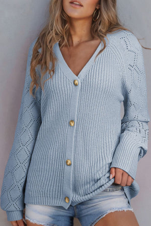 Light blue diamond-cut sleeve knit cardigan with button front and V-neck.