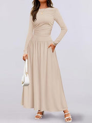 Apricot ruched long sleeve maxi dress with pockets and a gathered waist.