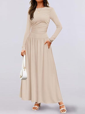 Apricot ruched long sleeve maxi dress with pockets and a gathered waist.