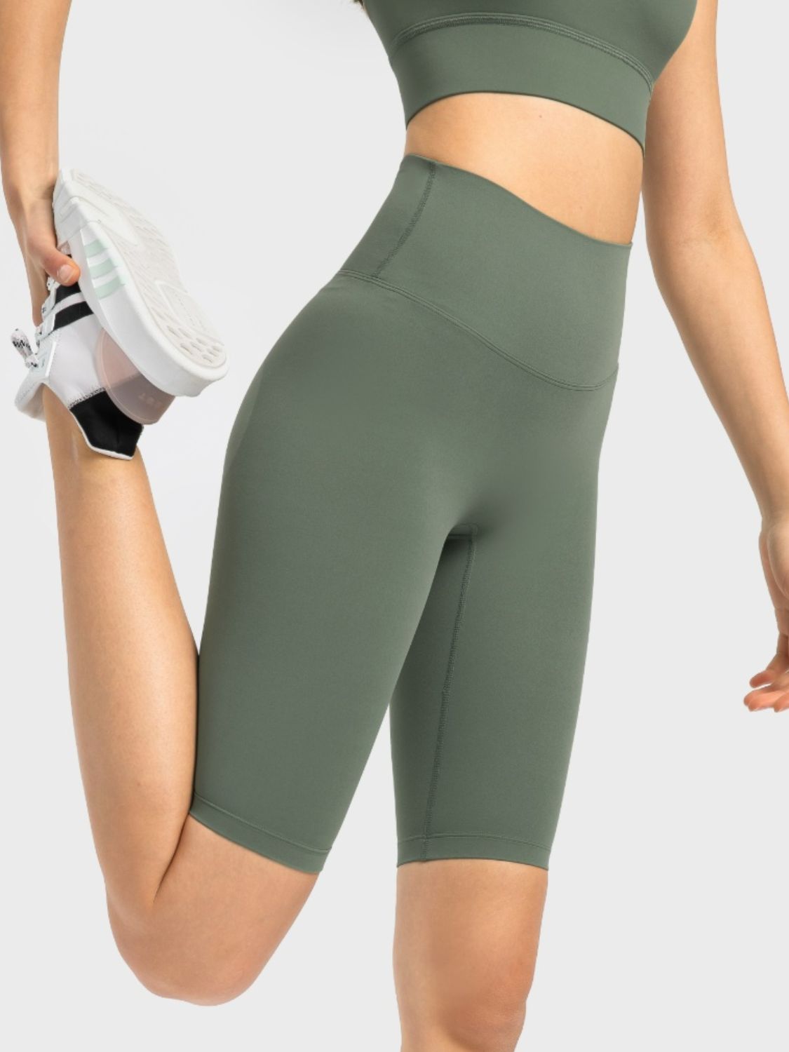 Sculpted active bike shorts in Matcha Green with a high waist and seamless design.
