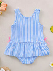 Blue striped seersucker one-piece swimsuit with ruffled hem and pink side bows