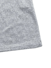 Light Gray knit maxi dress detail showing hem and fabric texture.