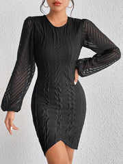 Black sheath dress with textured chevron sleeves and a tulip hem.