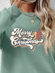 Sage green crewneck sweatshirt with Merry Christmas graphic and festive trees.