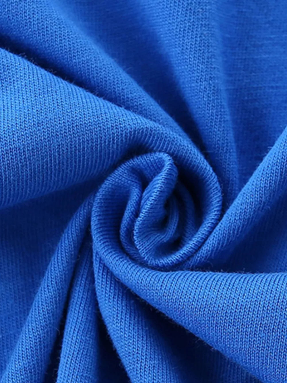 Blue cotton fabric detail of a baby outfit