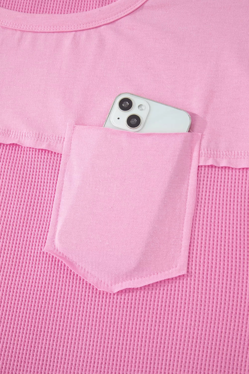 Pink waffled seam pocketed t-shirt with phone in pocket