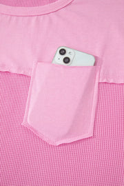 Pink waffled seam pocketed t-shirt with phone in pocket