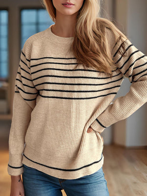 Breton stripe ribbed knit crewneck sweater in tan with black stripes, crew neck, long sleeves.