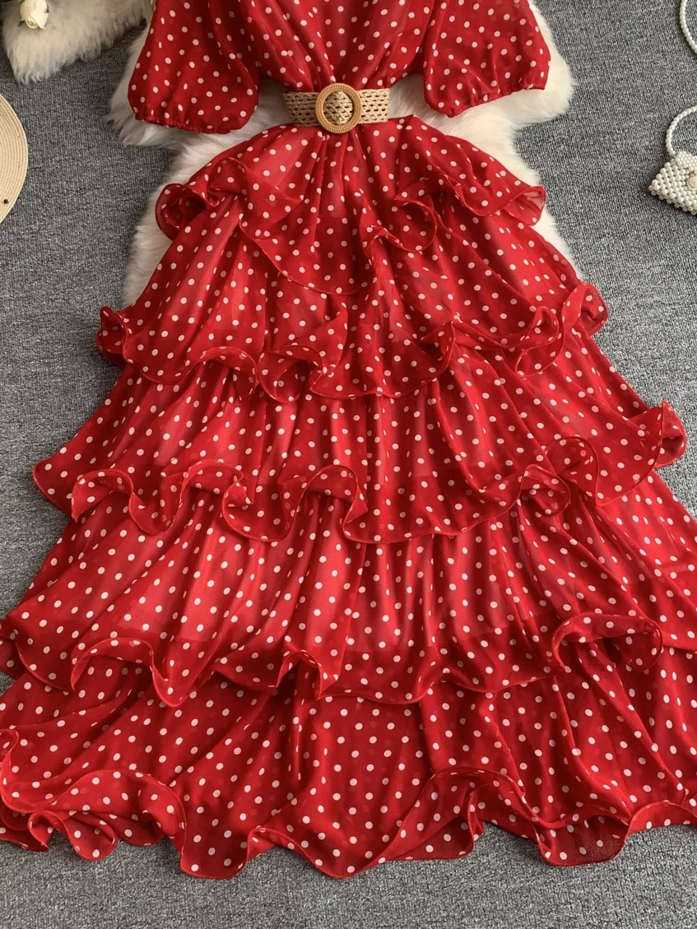 Red polka dot tiered ruffle dress with a woven belt