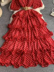 Red polka dot tiered ruffle dress with a woven belt