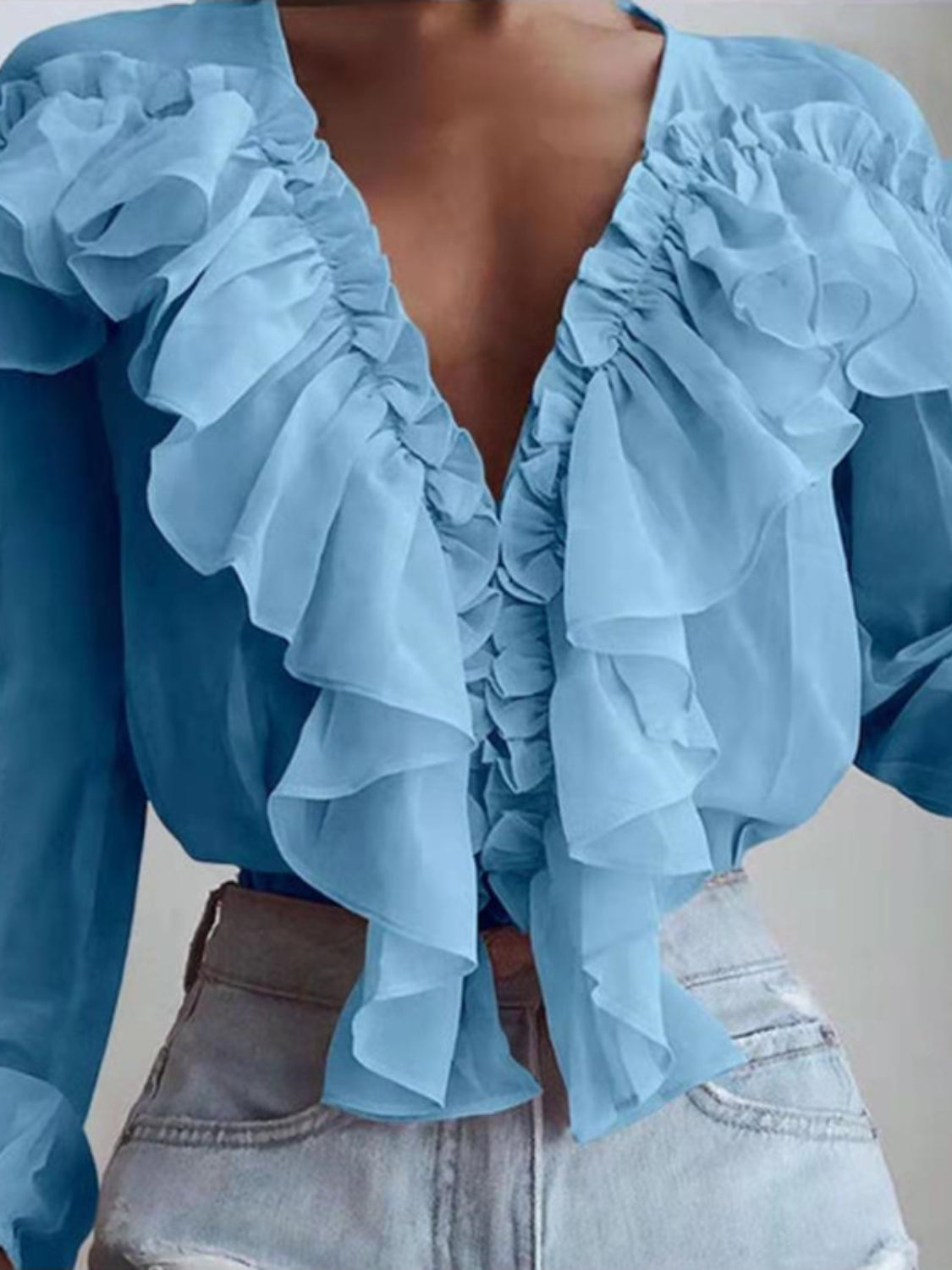 Sky blue chiffon blouse with cascading ruffles and plunging neckline