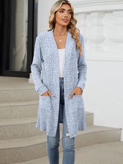 Light blue textured ribbed knit duster cardigan with pockets and long sleeves.