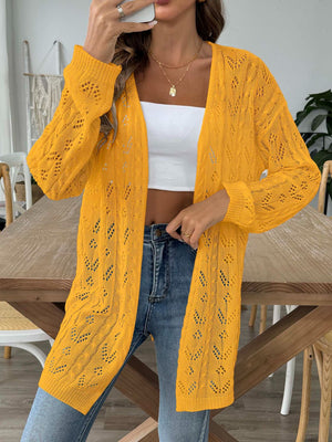 Openwork diamond knit duster cardigan in gold with long sleeves and open front.