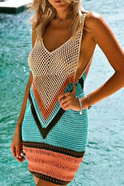 Geometric crochet beach dress with V-neck and fringe hem in multi-color stripes.