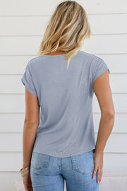 Light blue cowl neck cap-sleeve tee with subtle ribbed texture.