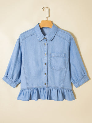 Light blue chambray button-down maternity shirt with ruffled hem and puff sleeves.