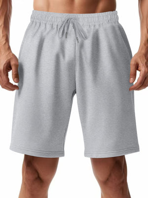 Light gray chino shorts with drawstring waist and pockets on a man.