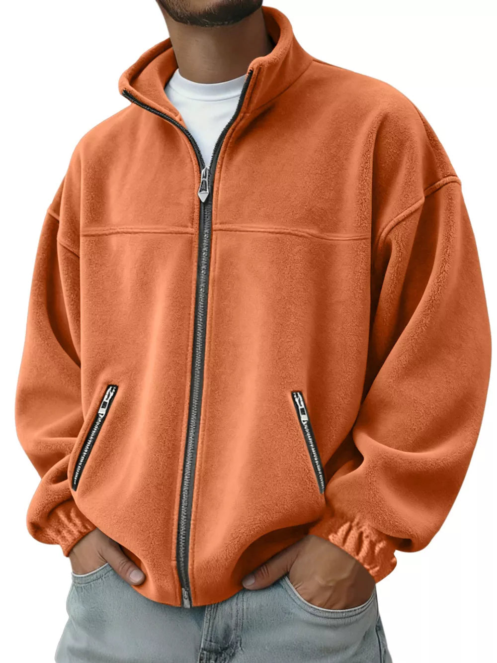 Orange fleece zip-up jacket with zippered pockets and mock neck