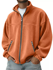 Orange fleece zip-up jacket with zippered pockets and mock neck