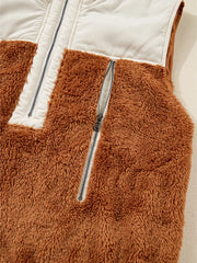 Cozy color block vest coat in brown and beige fuzzy fleece with a zippered front pocket and white panel.