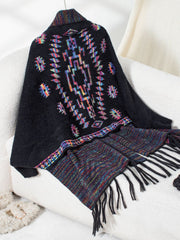 Black Aztec fringe knit cardigan with colorful geometric pattern and fringed hem.