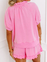 Pink cotton co-ord set with ruffled neckline and hem shorts