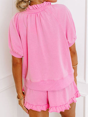 Pink cotton co-ord set with ruffled neckline and hem shorts