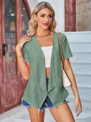 Sage perforated shawl collar jacket with short sleeves and pockets.