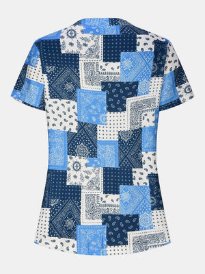 Blue bandana patchwork henley blouse with short sleeves and a buttoned neckline.