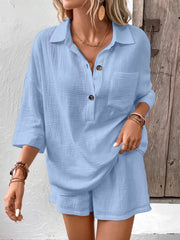 Sky blue cotton two-piece set with button-down shirt and shorts.