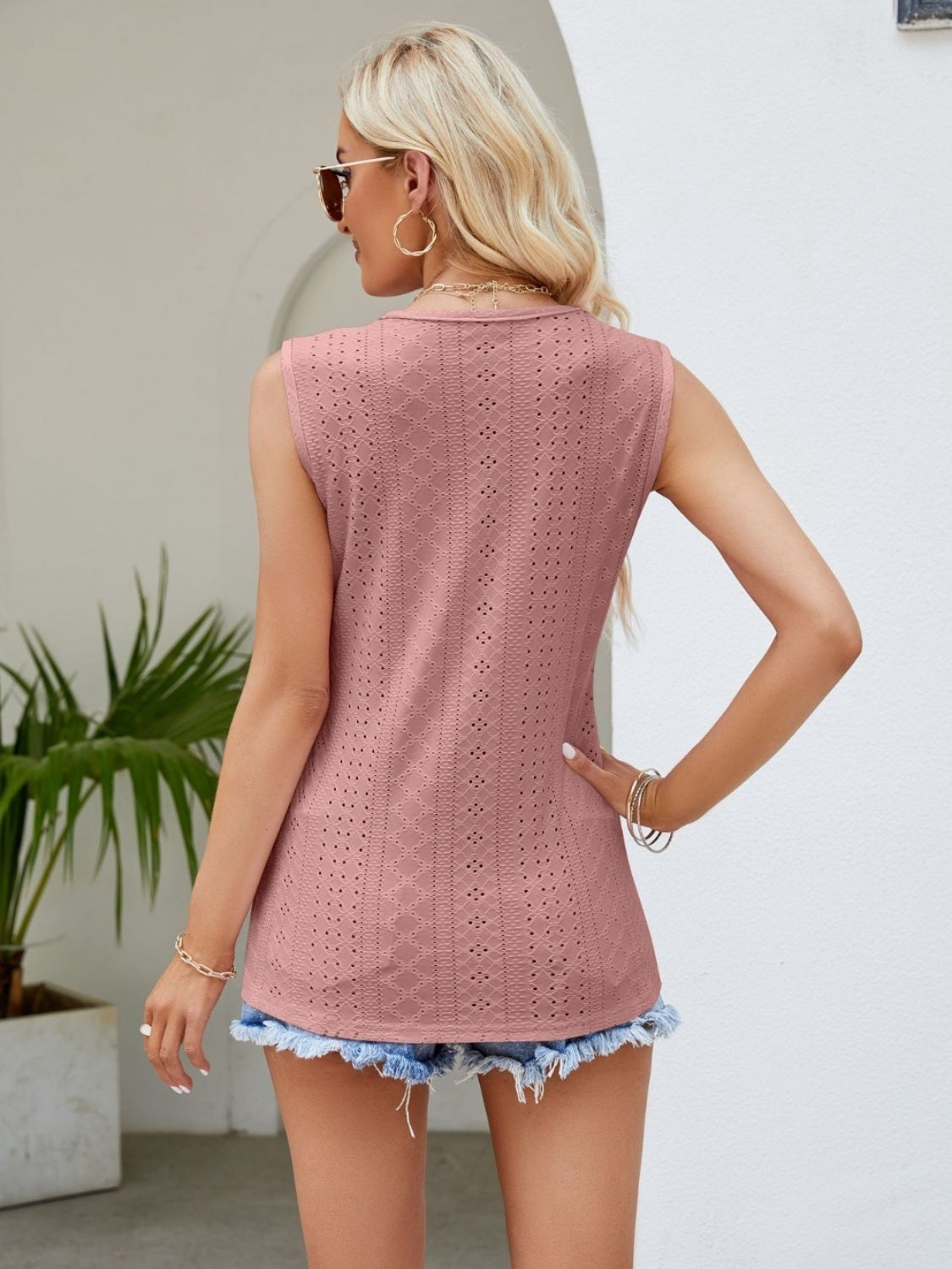 Scalloped eyelet tank top in dusty pink with center lace detail and diamond pattern.