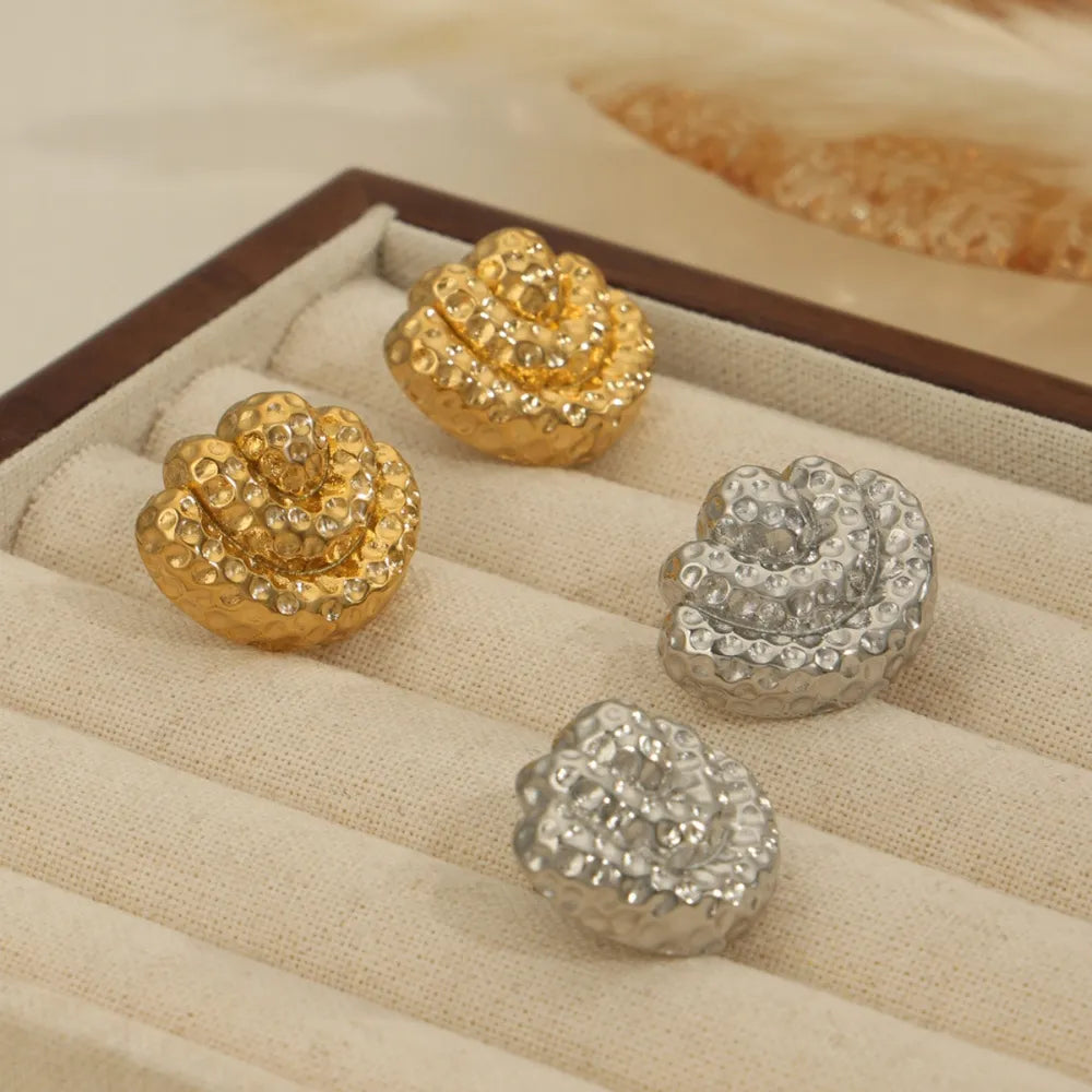 Textured shell stud earrings in gold and silver with hammered finish