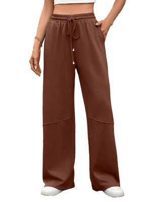 High-waist drawstring wide-leg pants in brown with pockets and paneled detail.