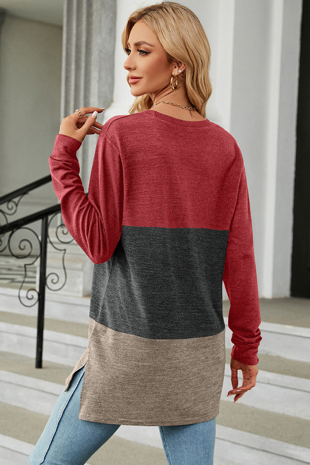 Colorblock long sleeve tee with red, charcoal, and camel panels and side slits.